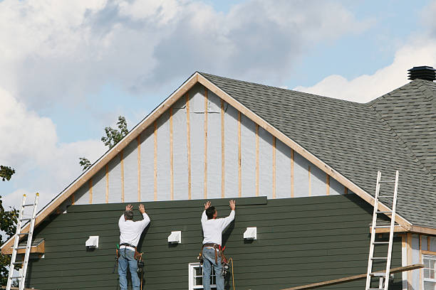 Professional Siding technician working in Portage, IN